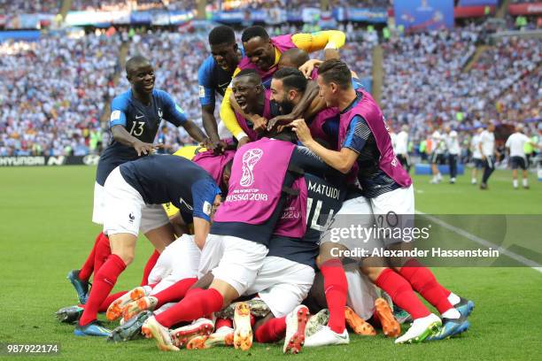 Kylian Mbappe of France celebrates with teammates after scoring his team's third goal during the 2018 FIFA World Cup Russia Round of 16 match between...