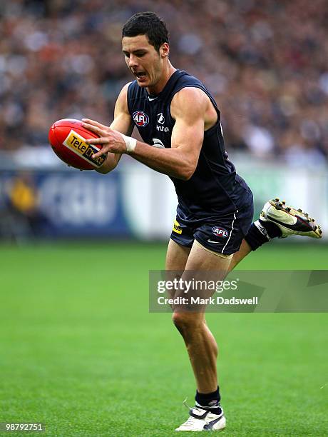 Simon White of the Blues gathers the ball during the round six AFL match between the Carlton Blues and the Collingwood Magpies at Melbourne Cricket...