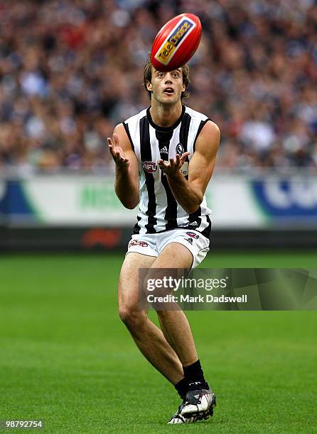 Ben Reid of the Magpies gathers the ball during the round six AFL match between the Carlton Blues and the Collingwood Magpies at Melbourne Cricket...