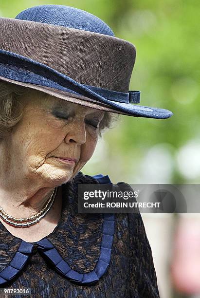 Dutch Queen Beatrix closes her eyes on April 29, 2010 in Apeldoorn during the ceremony for unveiling the monument of remembrance for the victims of...