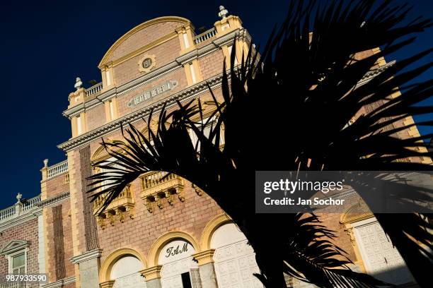 Palm tree is seen in front of Teatro Heredia, a theatre located in the colonial walled city on December 15, 2017 in Cartagena, Colombia. After the...