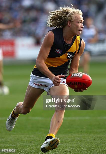 Ben Nason of the Tigers handballs during the round six AFL match between the Geelong Cats and the Richmond Tigers at Skilled Stadium on May 2, 2010...