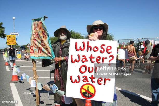 An Anti Fracking Protester dressed as a Lord of the Rings character, "Gandalf the Wizard" holds a banner reading "Don't Frack The Shires" outside the...