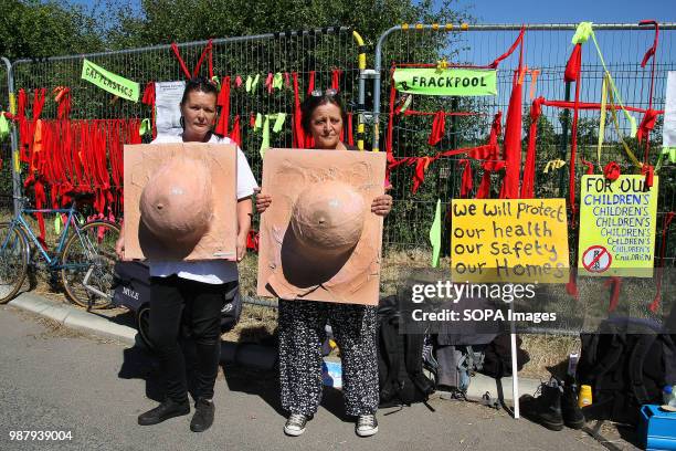 Two local Anti Frack Protesters hold imitation "Breast Sculptures" to highlight the claims that discharged waste Fracking Water causes breast cancer,...