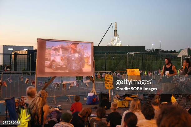 Anti-Fracking Protesters, outside Gas Company "Cuadrilla's" Frack site gather, as darkness falls, to watch an inspirational Anti-Frack Film "The...