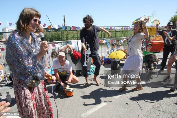 Members of national Direct Action Group "Reclaim the Power" sing and Dance and play instruments as part of a 48 hour Protest Blockade, shutting down...
