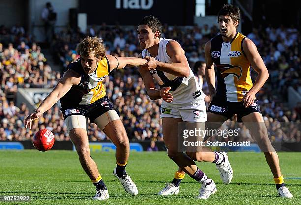 Will Schofield of the Eagles is tackled by Anthony Morabito of the Dockers during the round six AFL match between the West Coast Eagles and the...