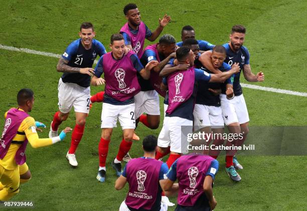 Kylian Mbappe of France celebrates after scoring his side's fourth goal with team mates during the 2018 FIFA World Cup Russia Round of 16 match...