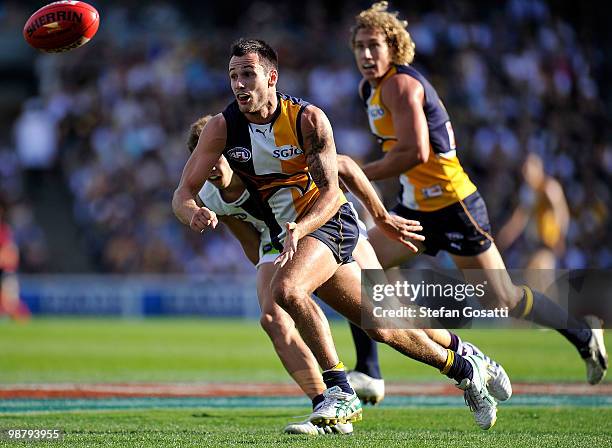 Chris Masten of the Eagles handballs away during the round six AFL match between the West Coast Eagles and the Fremantle Dockers at Subiaco Oval on...