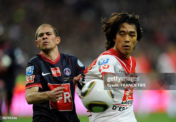 Paris Saint-Germain's French defender Christophe Jallet vies AS Monaco's South Korean striker Chu-Young Park with during the French Cup final between...