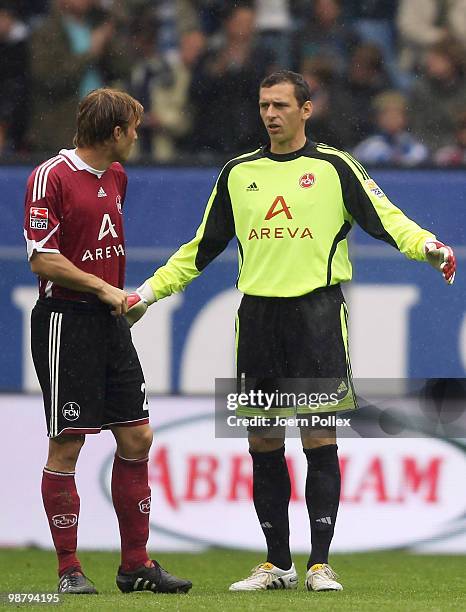 Andreas Ottl and Raphael Schaefer of Nuernberg are seen during during the Bundesliga match between Hamburger SV and 1. FC Nuernberg at HSH Nordbank...