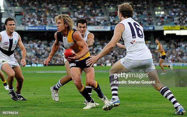 Matthew Priddis of the Eagles is tackled by Chris Tarrant of the Dockers during the round six AFL match between the West Coast Eagles and the...