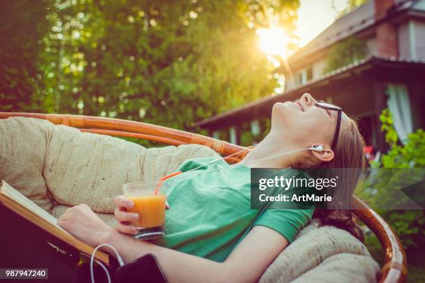 teenage girl enjoying summer in back yard - artmarie stock pictures, royalty-free photos & images