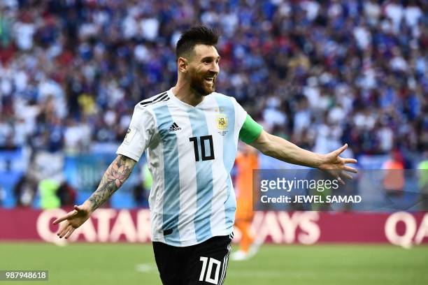 Argentina's forward Lionel Messi celebrates after his team scored a second goal during the Russia 2018 World Cup round of 16 football match between...