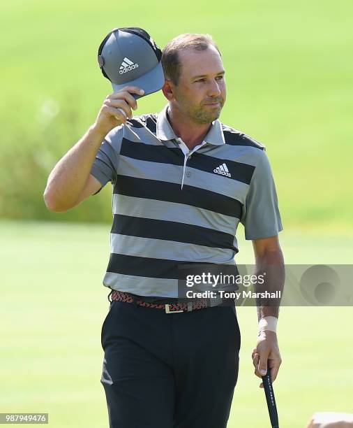 Sergio Garcia of Spain celebrates finishing his round on the 18th green during Day Three of the HNA Open de France at Le Golf National on June 30,...