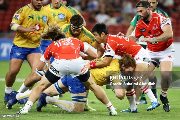 Fumiaki Tanaka of Sunwolves tackles Jannes Kirsten of Bulls during the Super Rugby match between Sunwolves and Bulls at the Singapore National...