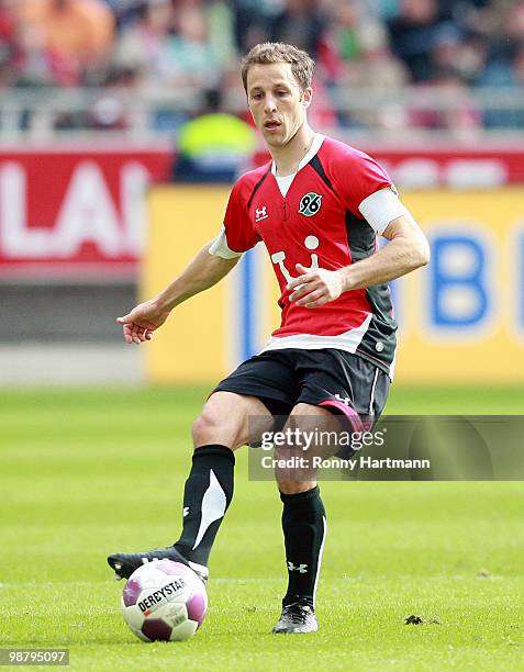 Steven Cherundolo of Hannover kicks the ball during the Bundesliga match between Hannover 96 and Borussia Moenchengladbach at AWD Arena on May 1,...