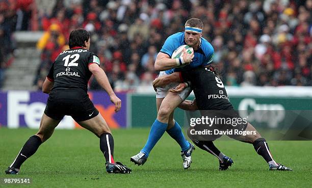 Jamie Heaslip of Leinster is tackled by Byron Kelleher during the Heineken Cup semi final match between Toulouse and Leinster at Stade Municipal on...