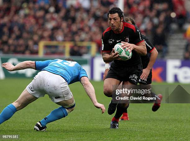 Byron Kelleher of Toulouse takes on Brian O'Driscoll during the Heineken Cup semi final match between Toulouse and Leinster at Stade Municipal on May...