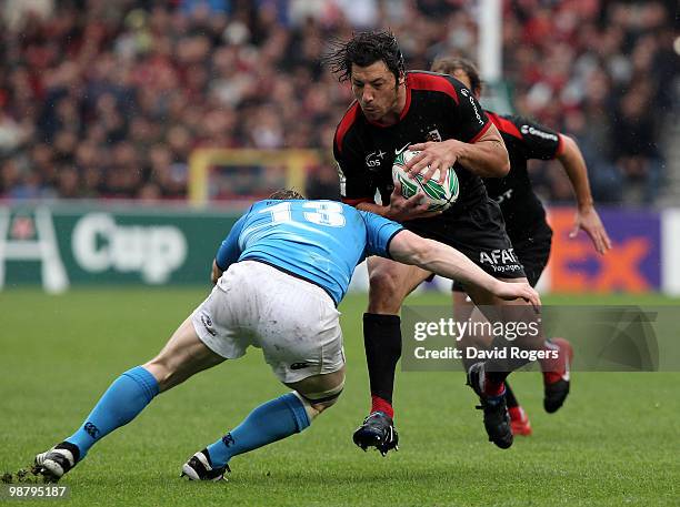 Byron Kelleher of Toulouse takes on Brian O'Driscoll during the Heineken Cup semi final match between Toulouse and Leinster at Stade Municipal on May...