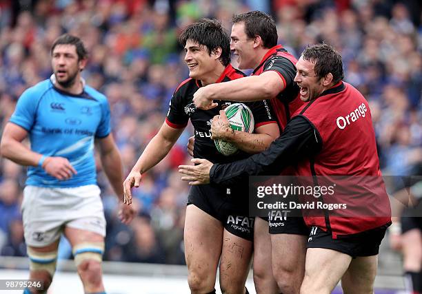 David Skrela of Toulouse is congratulated by team mates after scoring the second try during the Heineken Cup semi final match between Toulouse and...