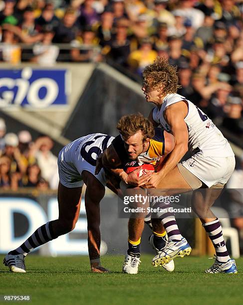 Will Schofield of the Eagles is tackled by Chris mayne of the Dockers during the round six AFL match between the West Coast Eagles and the Fremantle...