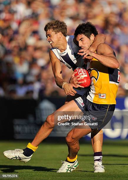 Stephen Hill of the Dockers tackles Matt Rosa of the Eagles during the round six AFL match between the West Coast Eagles and the Fremantle Dockers at...