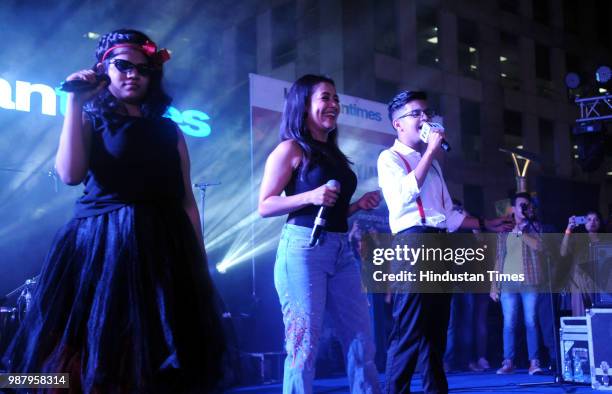 Bollywood singer Neha Kakkar with special children Parth and Prerna Aggarwal during the live performance in Hindustan Times Friday Jam season 5 at...