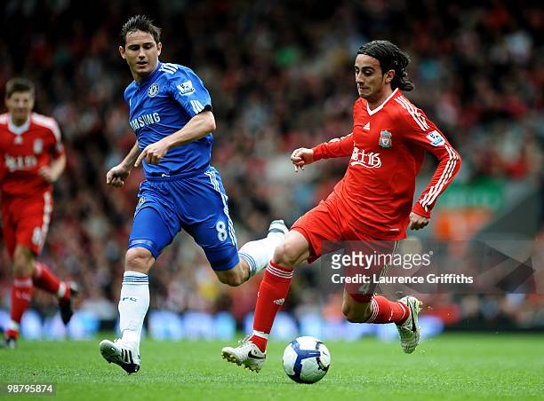 Alberto Aquilani of Liverpool is pursued by Frank Lampard of Chelsea during the Barclays Premier League match between Liverpool and Chelsea at...