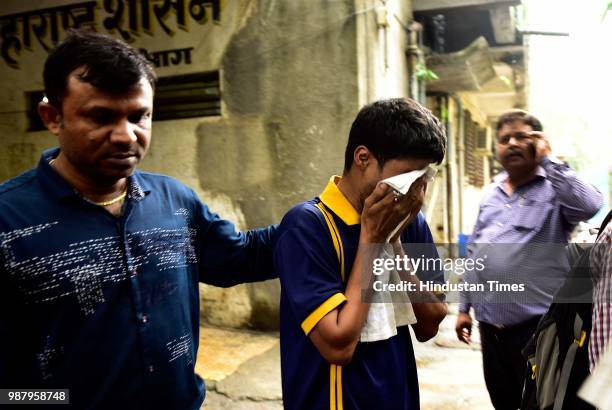 Arvind Dubey, brother of Deceased Govind dubey at Rajawadi Hospital Ghatkopar, on June 29, 2018 in Mumbai, India. Five people are reported to be...