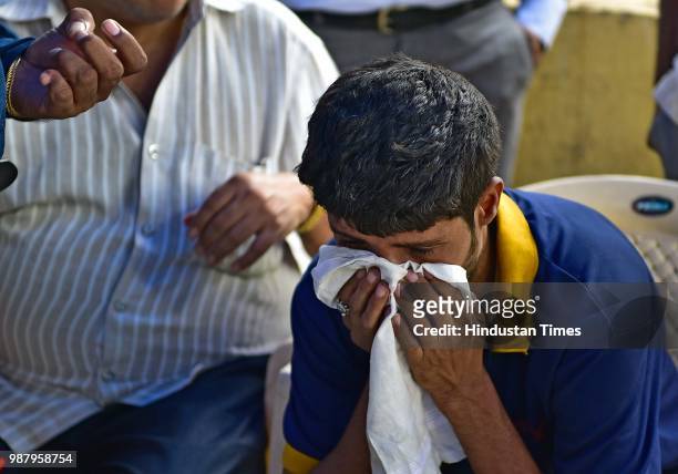 Arvind Dubey, brother of Deceased Govind dubey at Rajawadi Hospital Ghatkopar, on June 29, 2018 in Mumbai, India. Five people are reported to be...