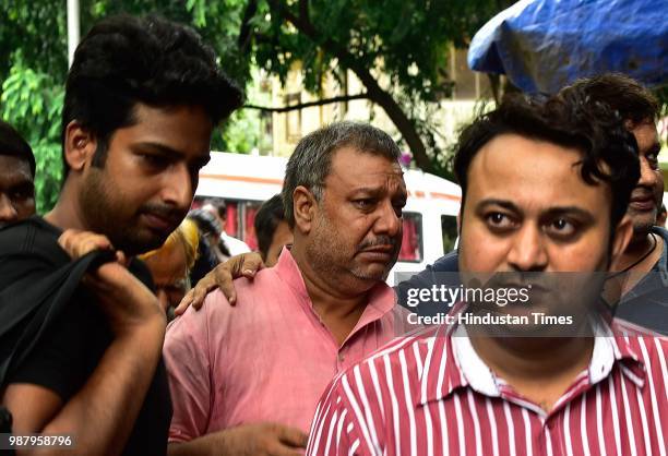 Father of deceased Manish Pandey at Rajawadi Hospital Ghatkopar, on June 29, 2018 in Mumbai, India. Five people are reported to be dead, including...