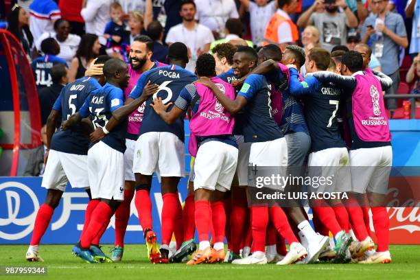 France's players celebrate their fourth goal during the Russia 2018 World Cup round of 16 football match between France and Argentina at the Kazan...