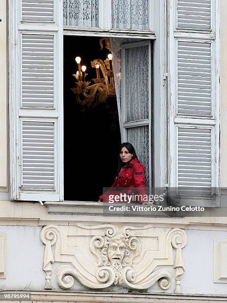 Woman looks from a window during the Holy Mass celebrated by Pope Benedict XVI in Piazza San Carlo on May 2, 2010 in Turin, Italy. Later in the day...