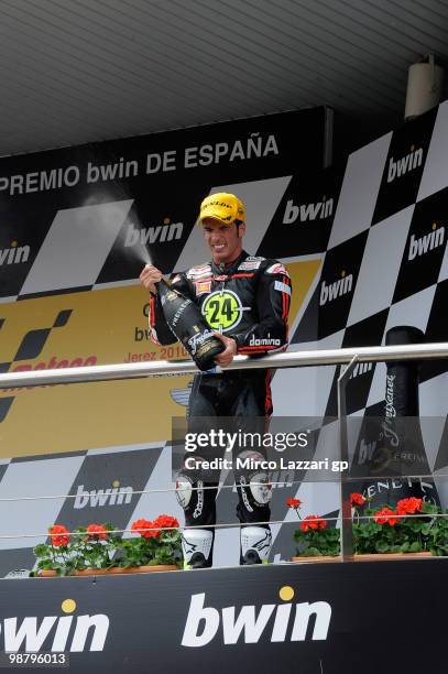 Toni Elias of Spain and Gresini Racing Moto2 celebrates and sprays champagne on the podium the victory at the end of the Moto2 race at Circuito de...