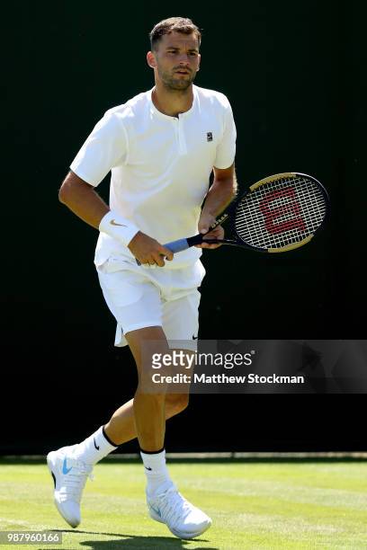Grigor Dimitrov of Bulgaria practices on court during training for the Wimbledon Lawn Tennis Championships at the All England Lawn Tennis and Croquet...