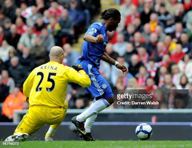 Didier Drogba of Chelsea latches onto a poor back pass to round Pepe Reina of Liverpool to score the opening goal during the Barclays Premier League...