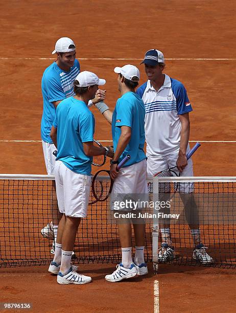 John Isner and Sam Querrey of USA congratulate Bob and Mike Bryan of USA for winning in the doubles final during day eight of the ATP Masters Series...