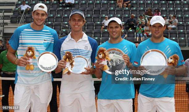 Bob and Mike Bryan of USA with the winners trophies after defeating John Isner and Sam Querrey of USA in the doubles final during day eight of the...