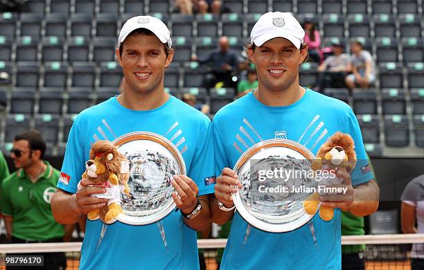 Bob and Mike Bryan of USA with the winners trophies after defeating John Isner and Sam Querrey of USA in the doubles final during day eight of the...