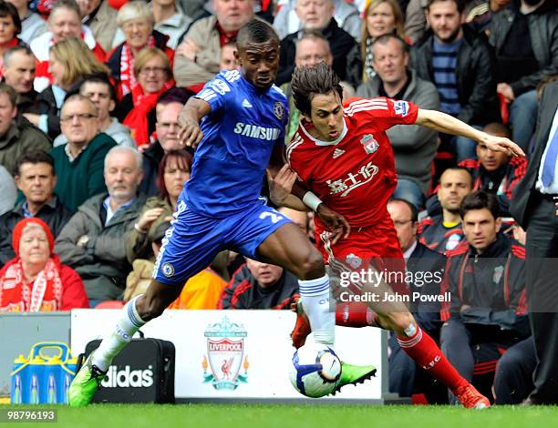 Yossi Benayoun of Liverpool competes with Salomon Kalou of Chelsea during the Barclays Premier League match between Liverpool and Chelsea at Anfield...