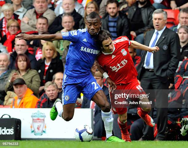 Yossi Benayoun of Liverpool competes with Salomon Kalou of Chelsea during the Barclays Premier League match between Liverpool and Chelsea at Anfield...