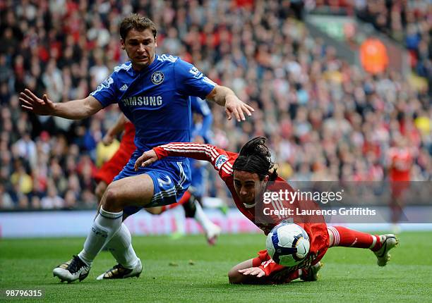 Alberto Aquilani of Liverpool clashes with Branislav Ivanovic of Chelsea during the Barclays Premier League match between Liverpool and Chelsea at...