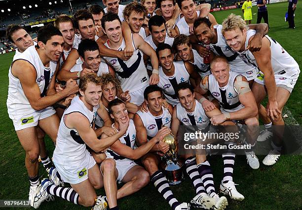 Dockers team celebrate after winning the Western Derby during round six AFL match between the West Coast Eagles and the Fremantle Dockers at Subiaco...