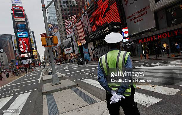 Traffic cop mans his post in a quiet Times Square near where a crude car bomb was discovered last night May 2, 2010 in New York City. Investigators...