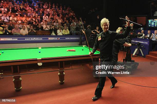 Neil Robertson of Australia makes his entrance ahead of the final against Graeme Dott of Scotland for the Betfred.com World Snooker Championships at...