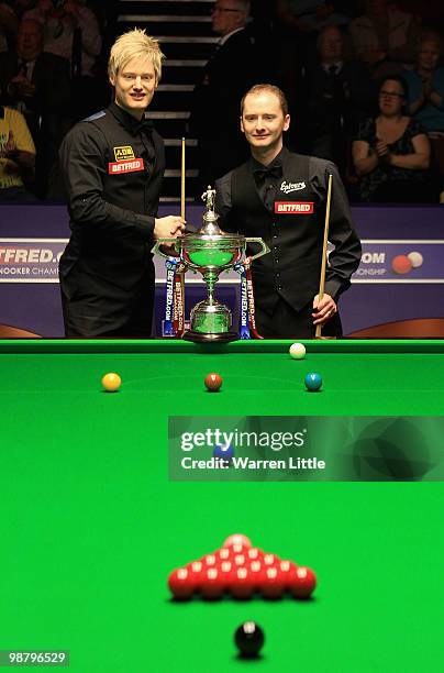 Neil Robertson of Australia and Graeme Dott of Scotland pose with the trophy before the final of the Betfred.com World Snooker Championships at The...