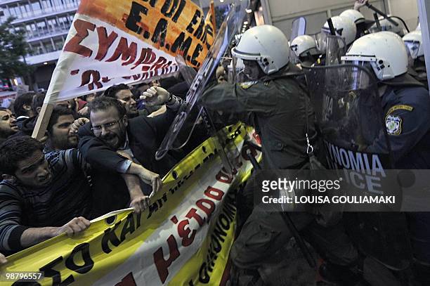 Protestors clash with riot policemen in front of the finance ministry during a demonstration, in Athens on April 29, 2010. Greek police clashed with...