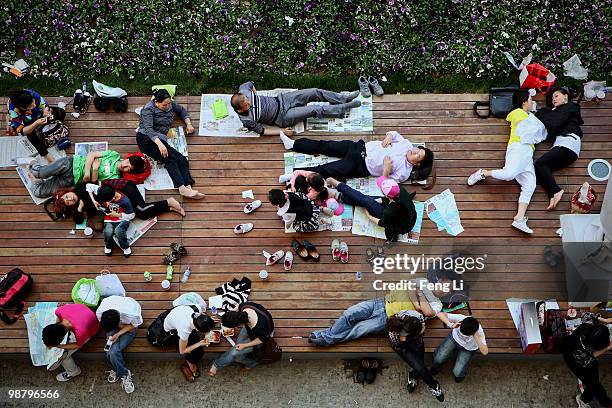 Visitors rest outside the China Pavilion on the second day of the Shanghai World Expo on May 2, 2010 in Shanghai, China. The expo, which runs through...