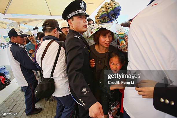 Visitors queue up to enter the France Pavilion on the second day of the Shanghai World Expo on May 2, 2010 in Shanghai, China. The expo, which runs...